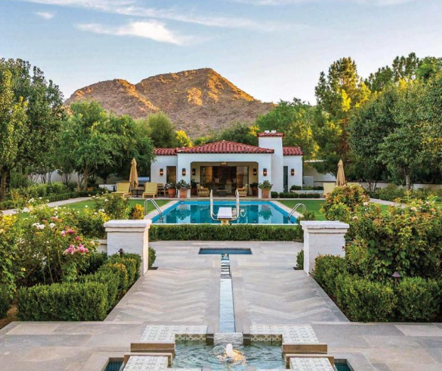 home exterior with pool and fountain