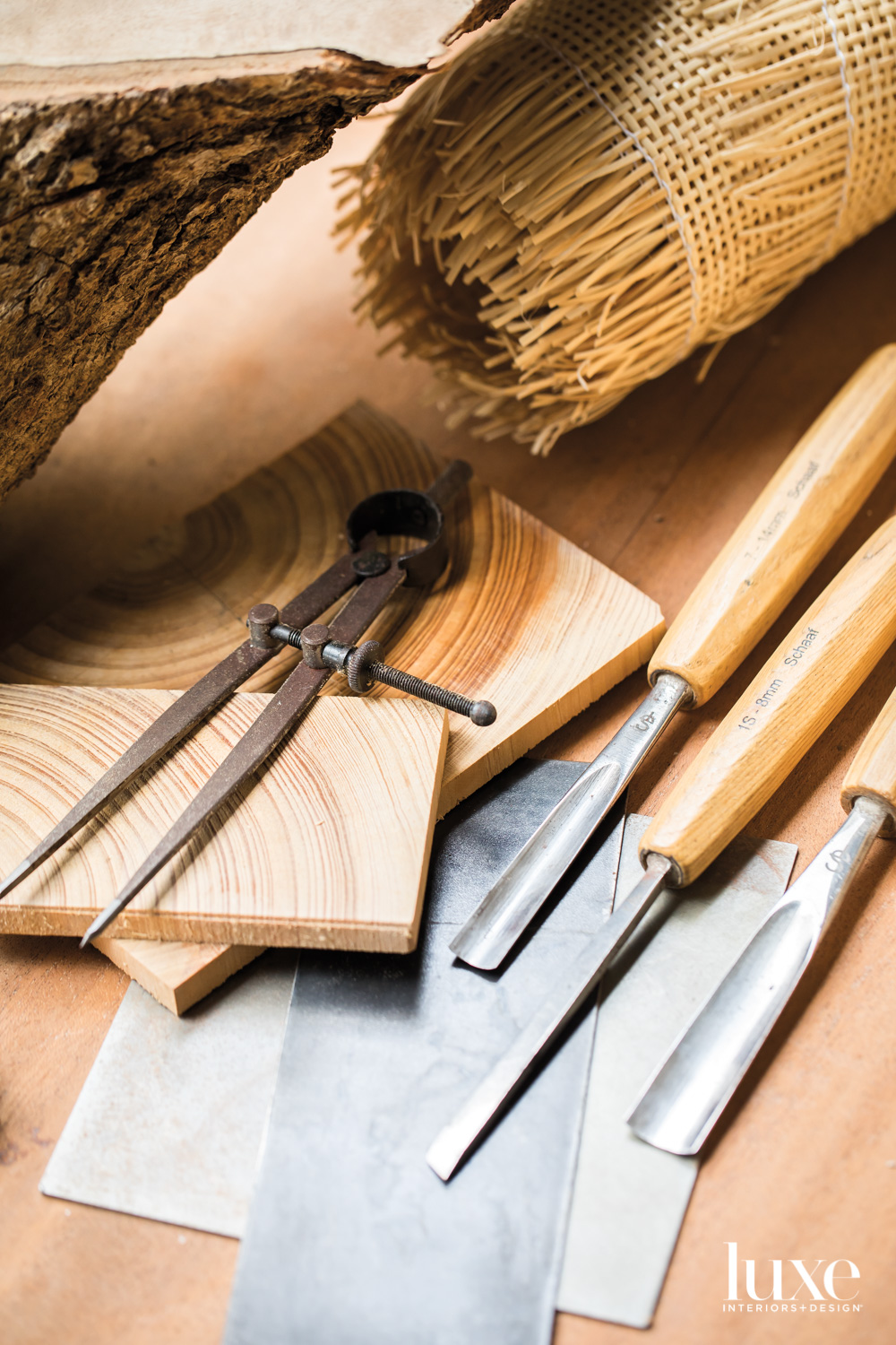 tools, a compass and carving chisels with caning, steel and pewter on a table