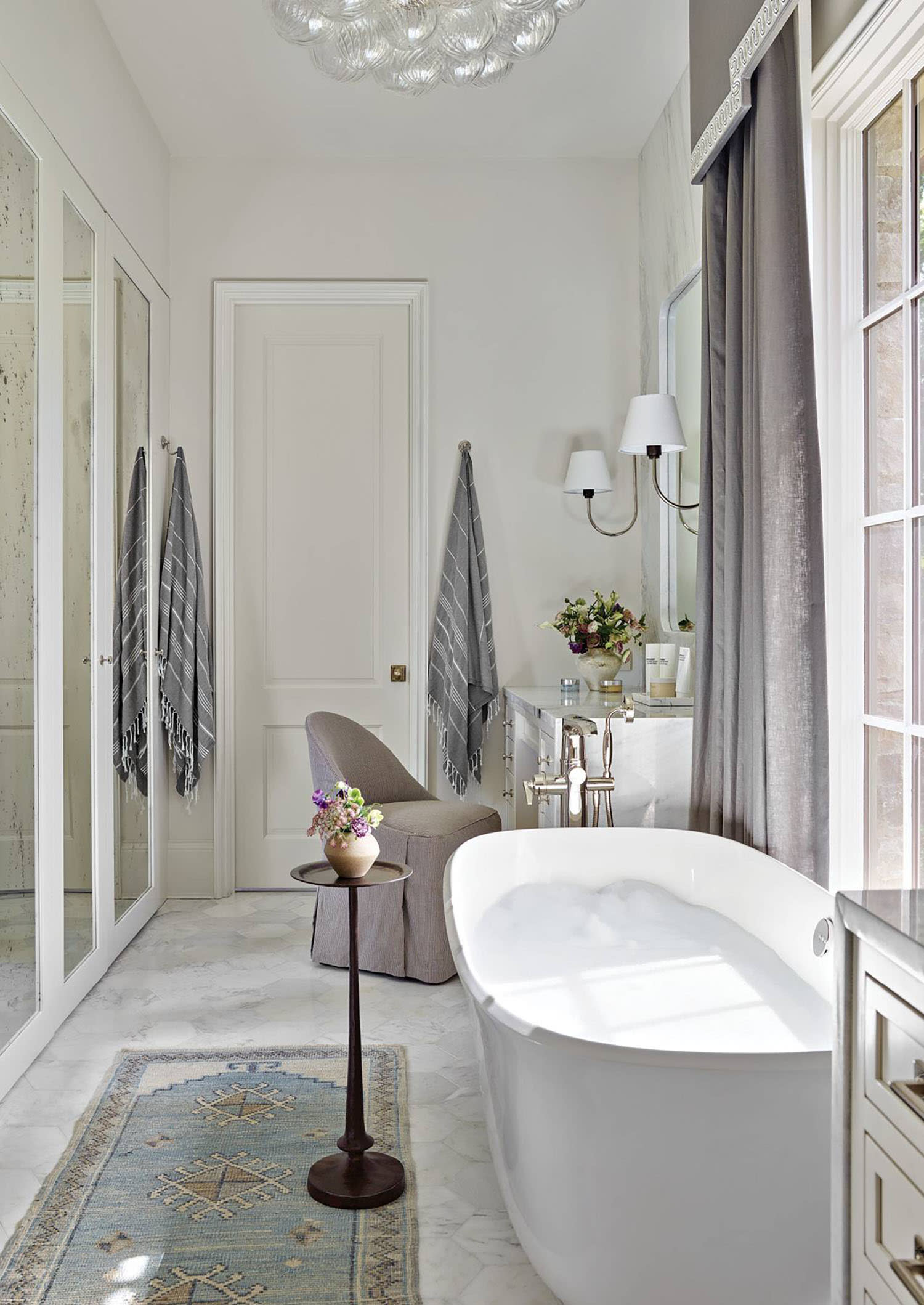traditional white bathroom with a freestanding tub