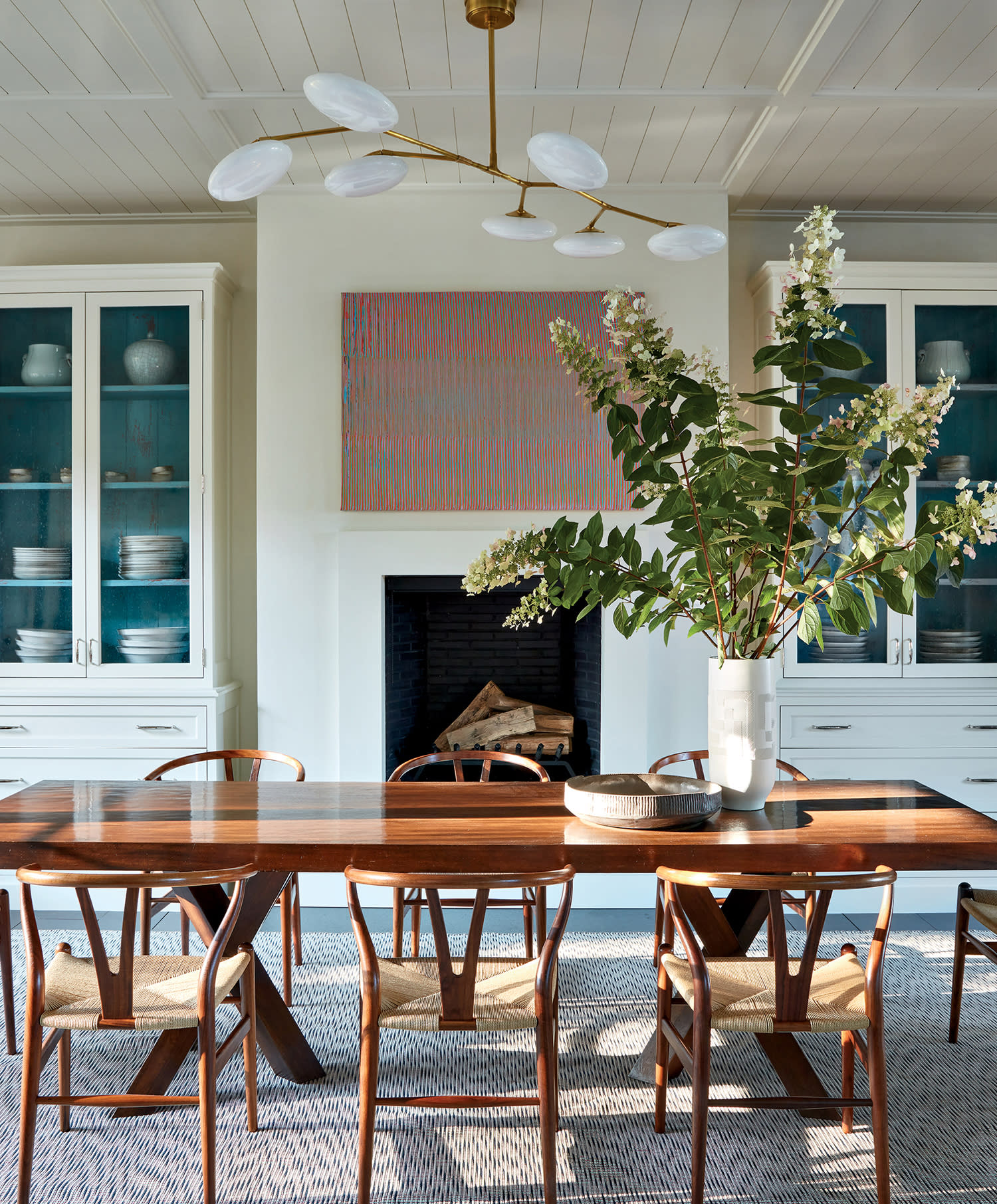 bright breakfast room with a mix of modern and vintage furnishings