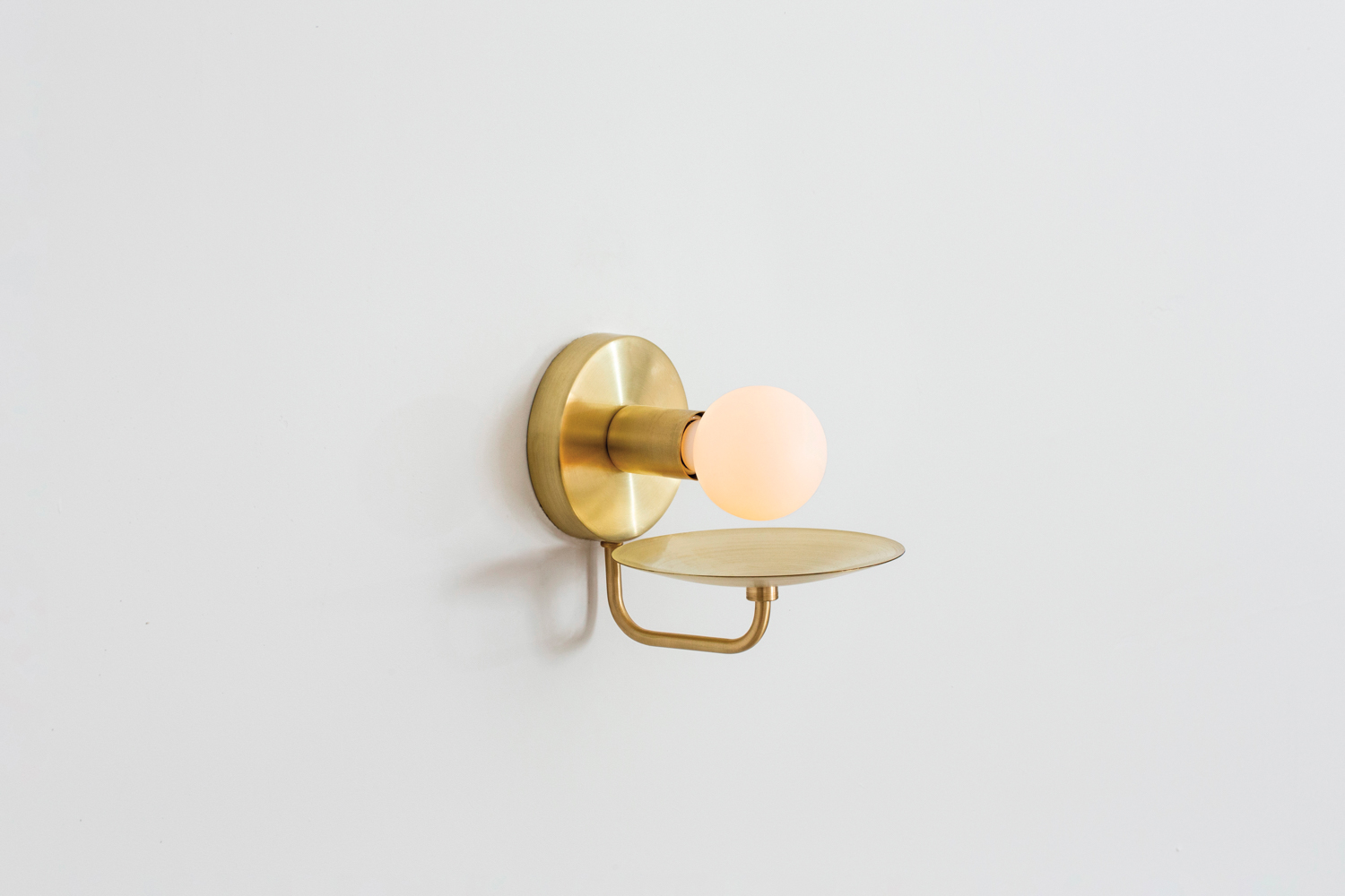 Dainty brass sconce