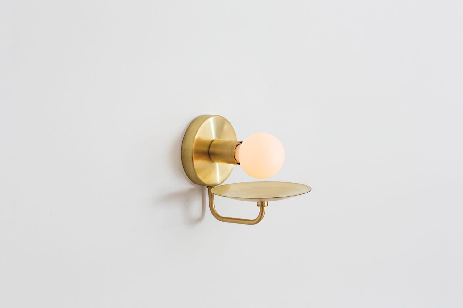 Dainty brass sconce