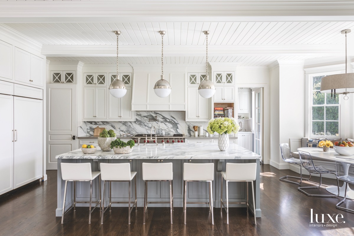 contemporary white kitchen marble island and backsplash