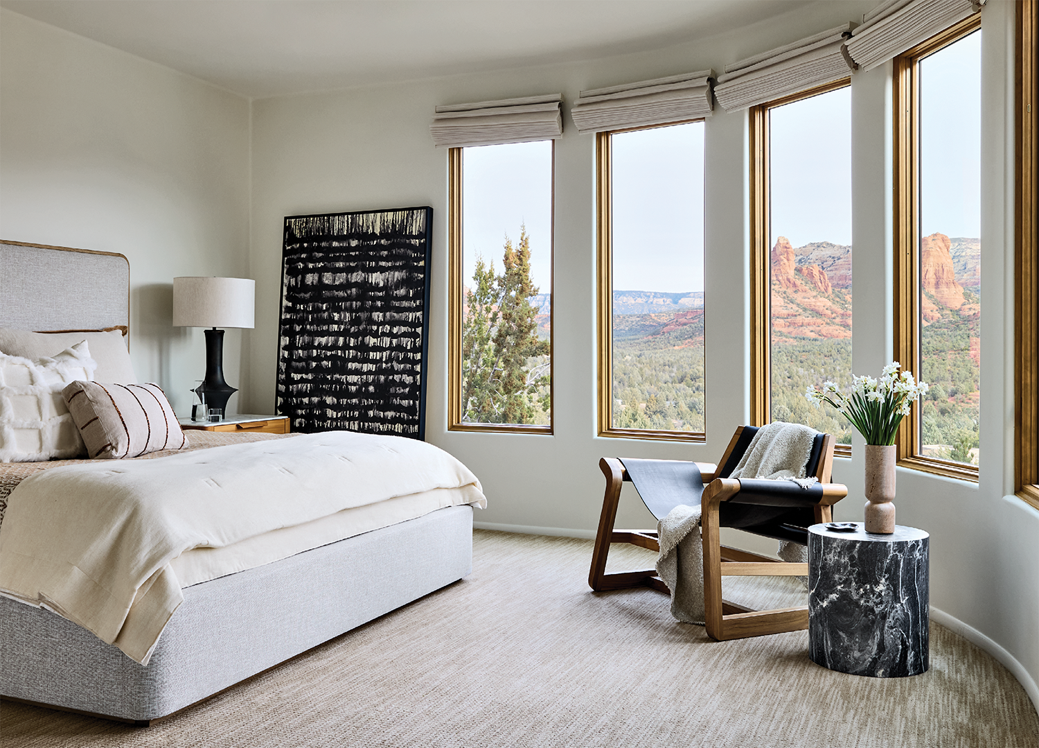 contemporary neutral bedroom with a row of windows