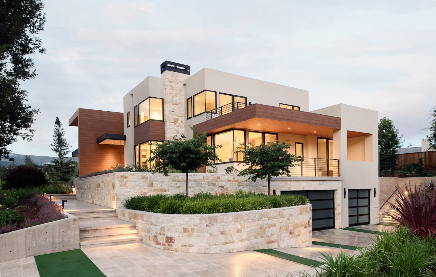 Luxury modern home with immaculate landscaping built by Conrado Home Builders.