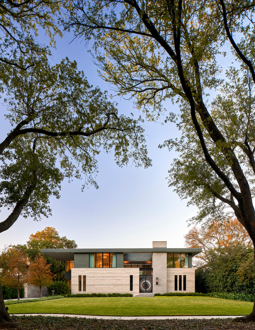 modern home exterior with glass and steel details.