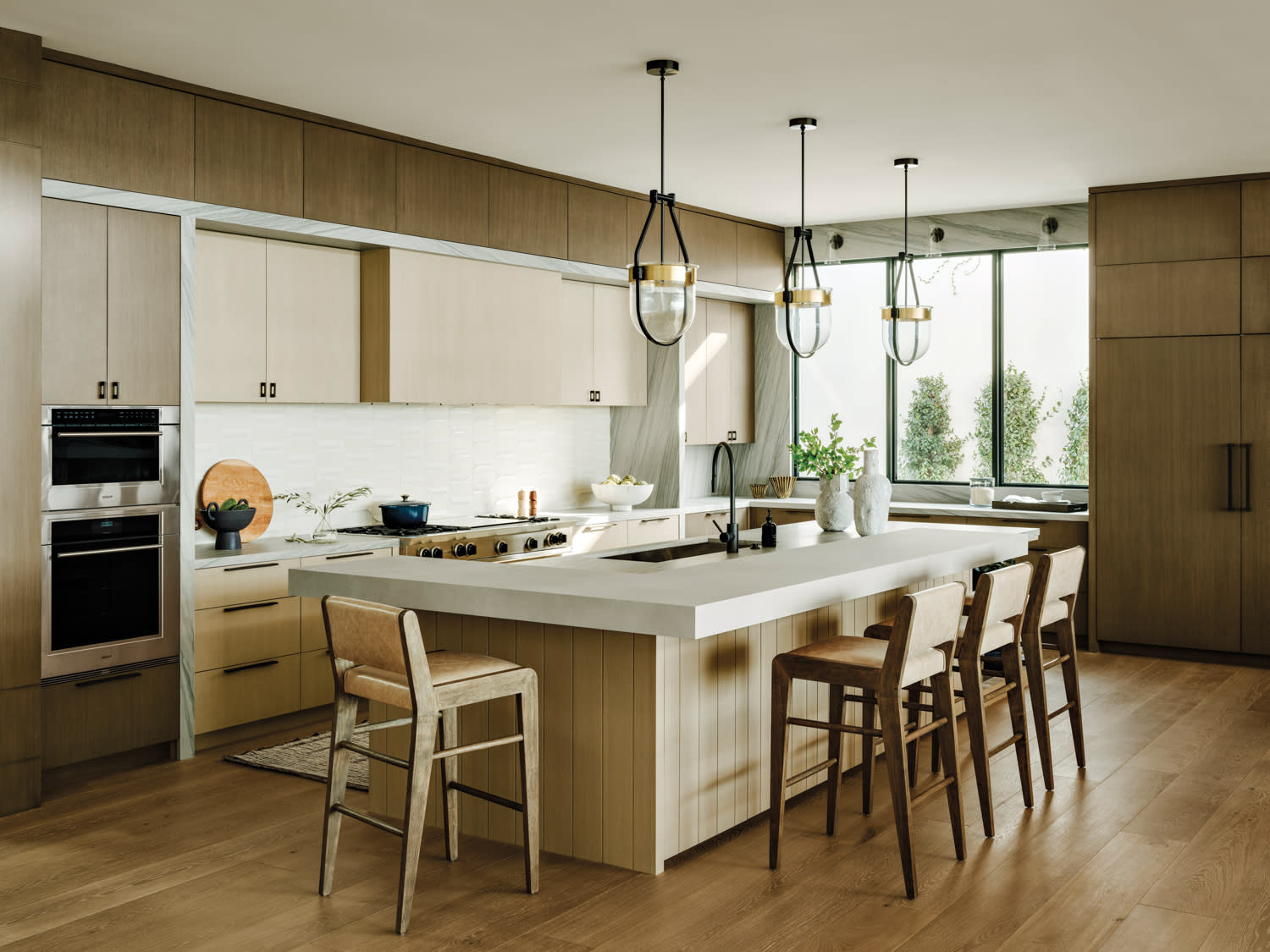 contemporary kitchen with two-tone oak cabinetry and a large island