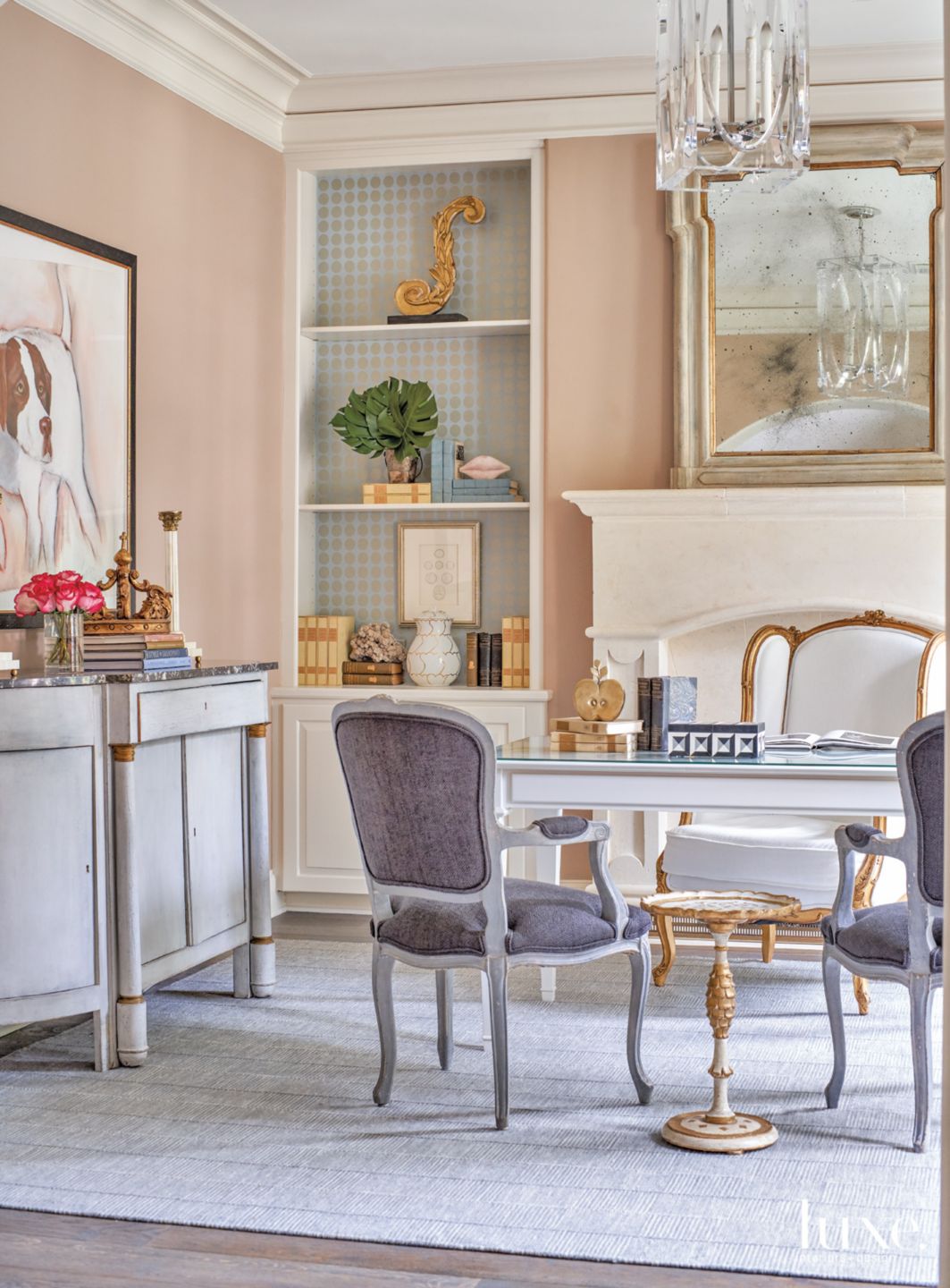 pink office with grey chairs and dog painting