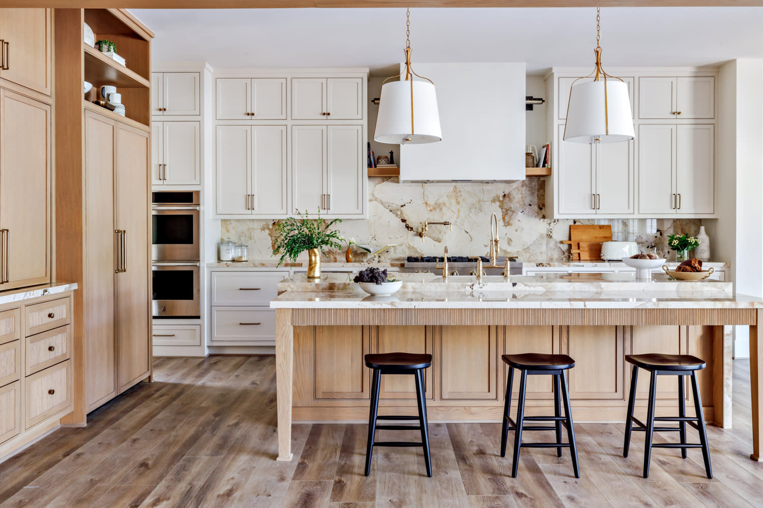 contemporary kitchen with light wood tones and warm accents