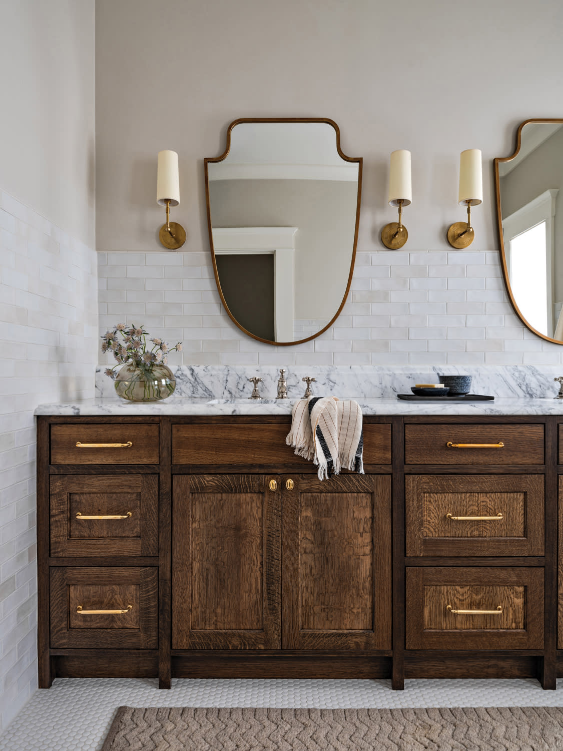 classic bathroom with a wood vanity and white tile