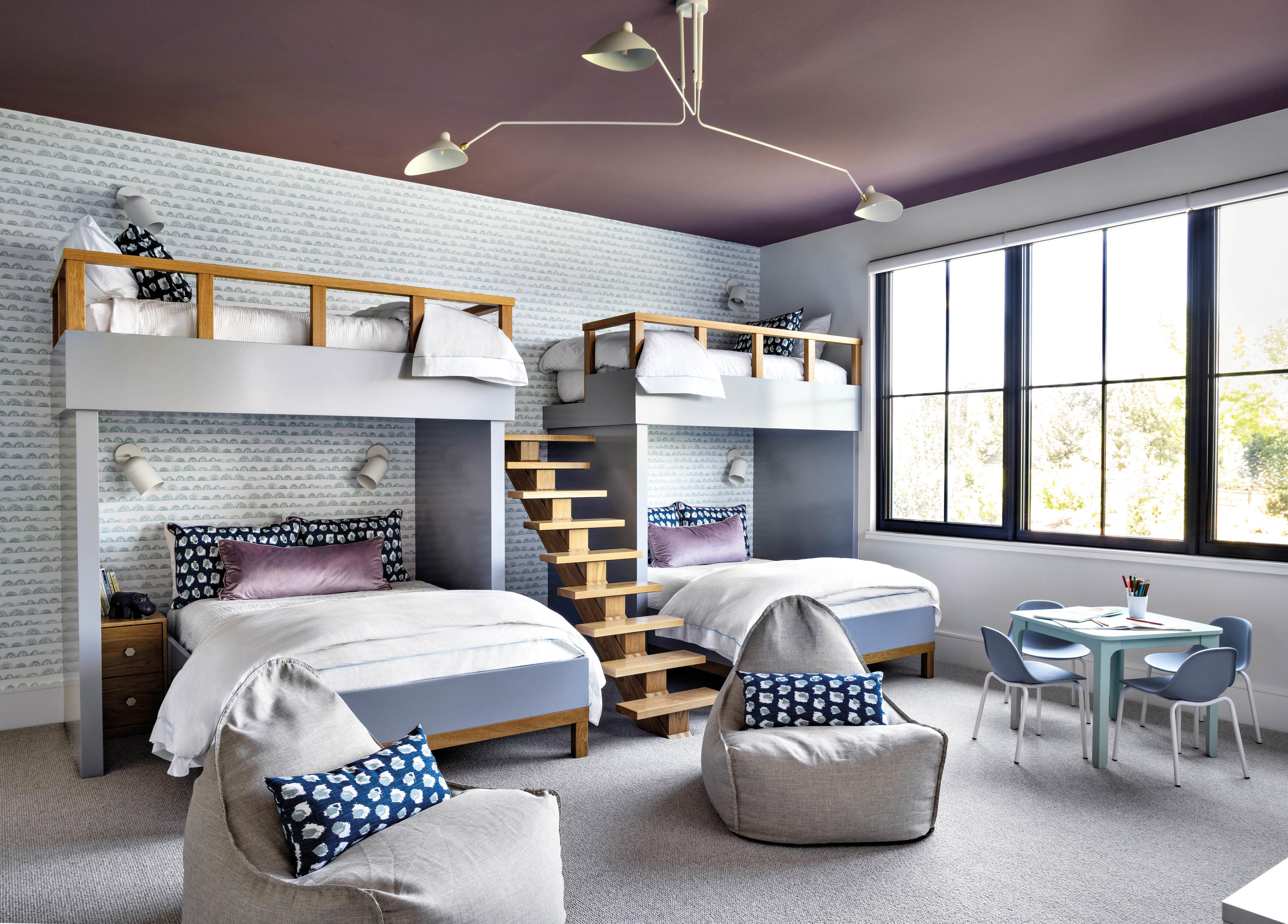 children's bedroom with a purple ceiling and matching bunk beds