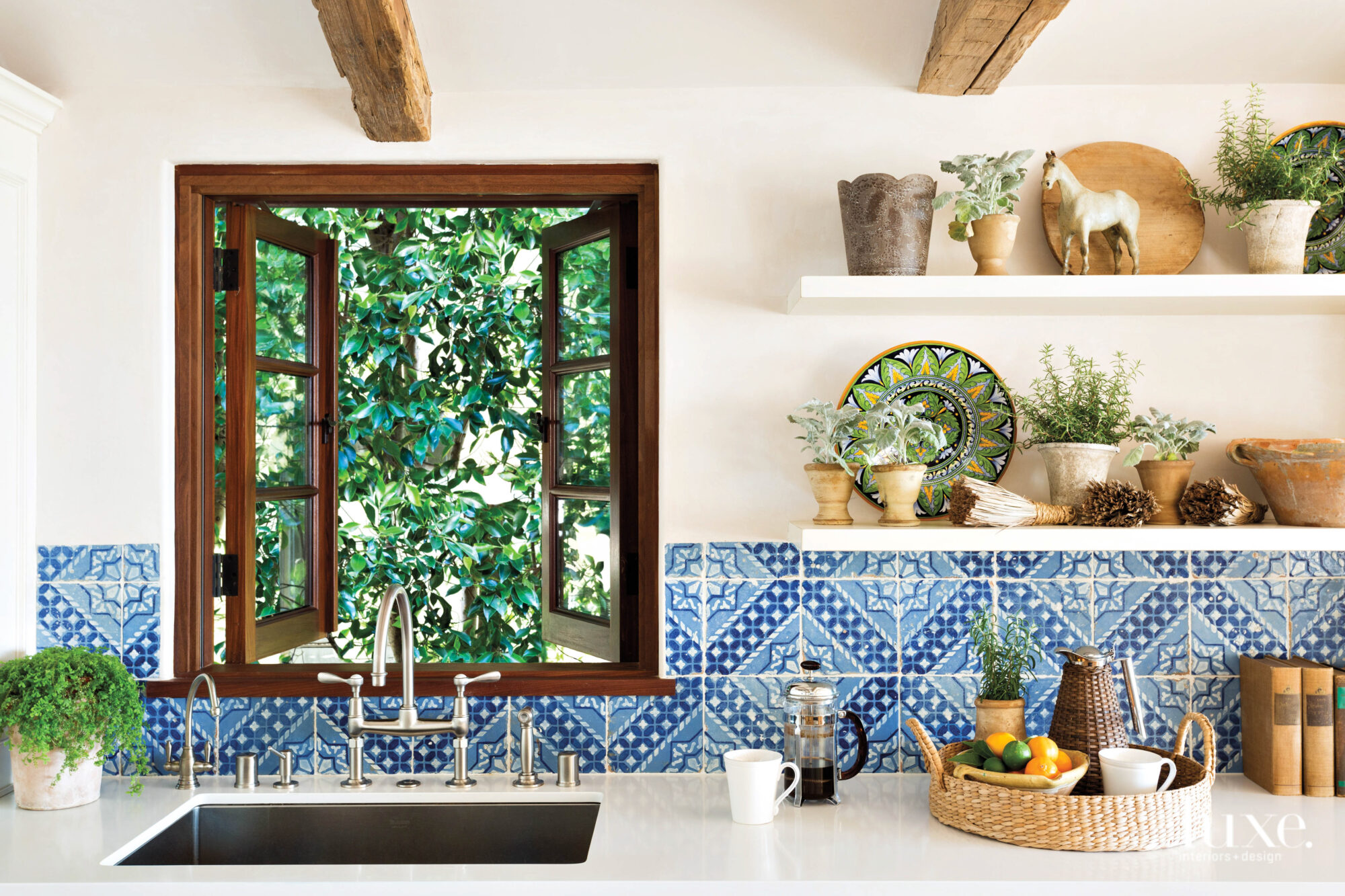 Detail shot of kitchen with blue tiled backsplash