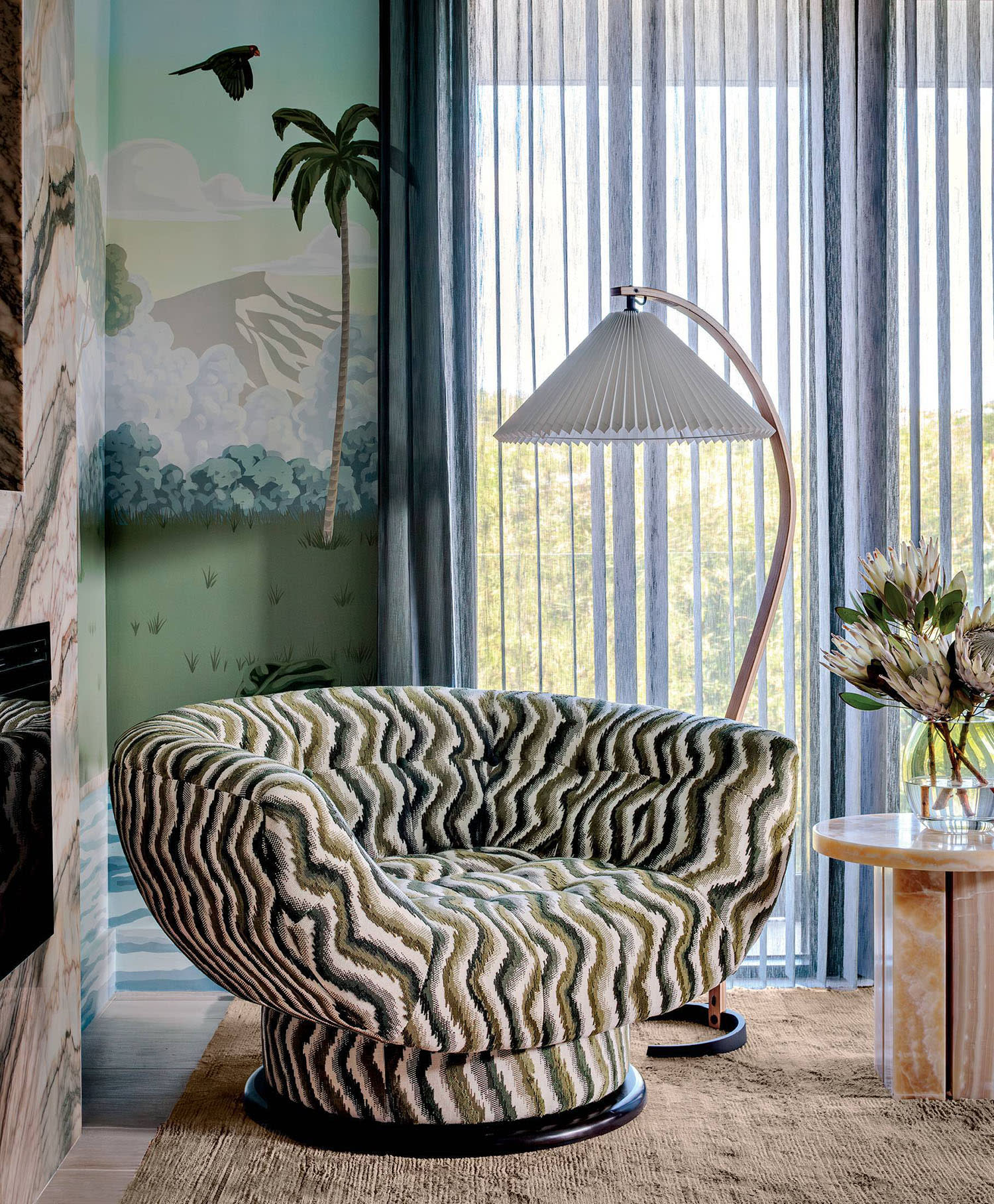an Adrian Pearsall armchair wears a Pierre Frey pattern in a bedroom