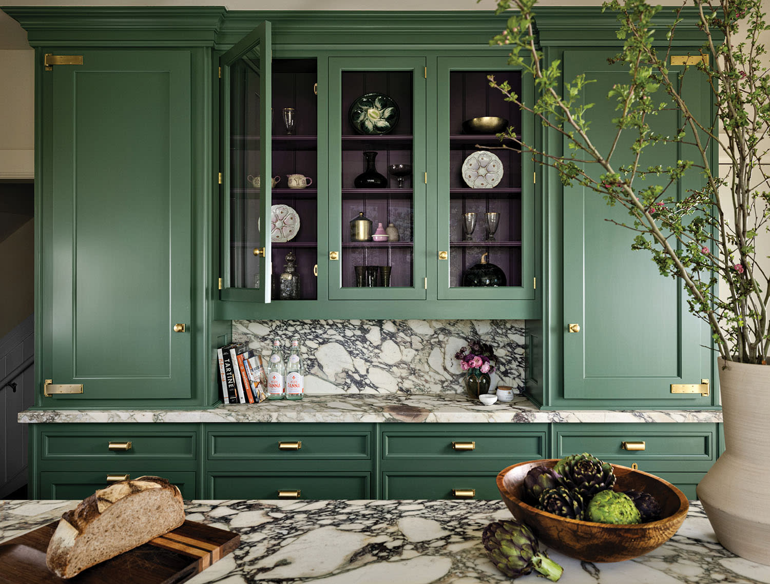 traditional kitchen with green cabinetry