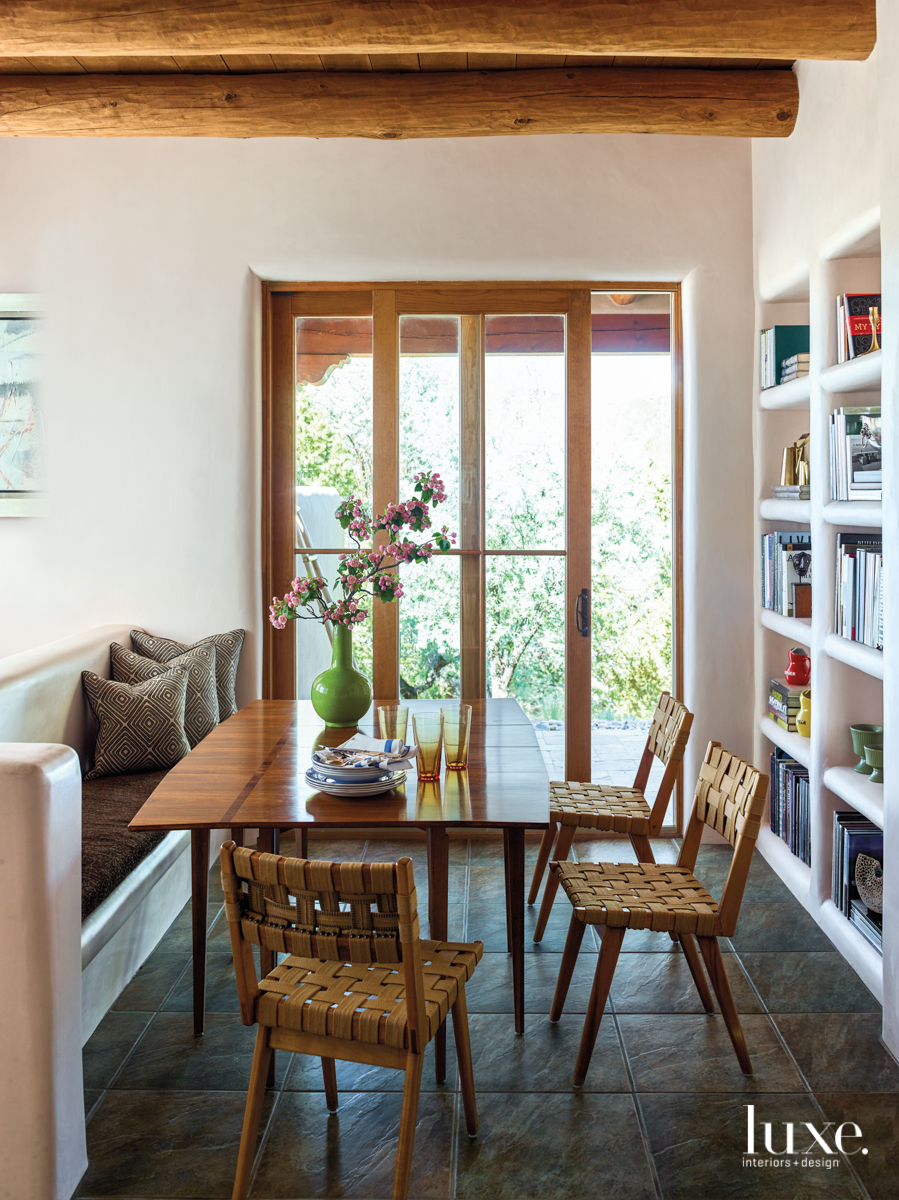 eclectic dining area bookshelves neutral