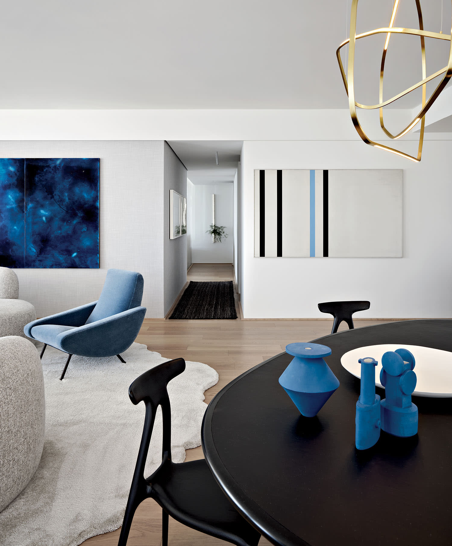 dining table in the living area of a sleek, modern high-rise in San Francisco designed by ODADA