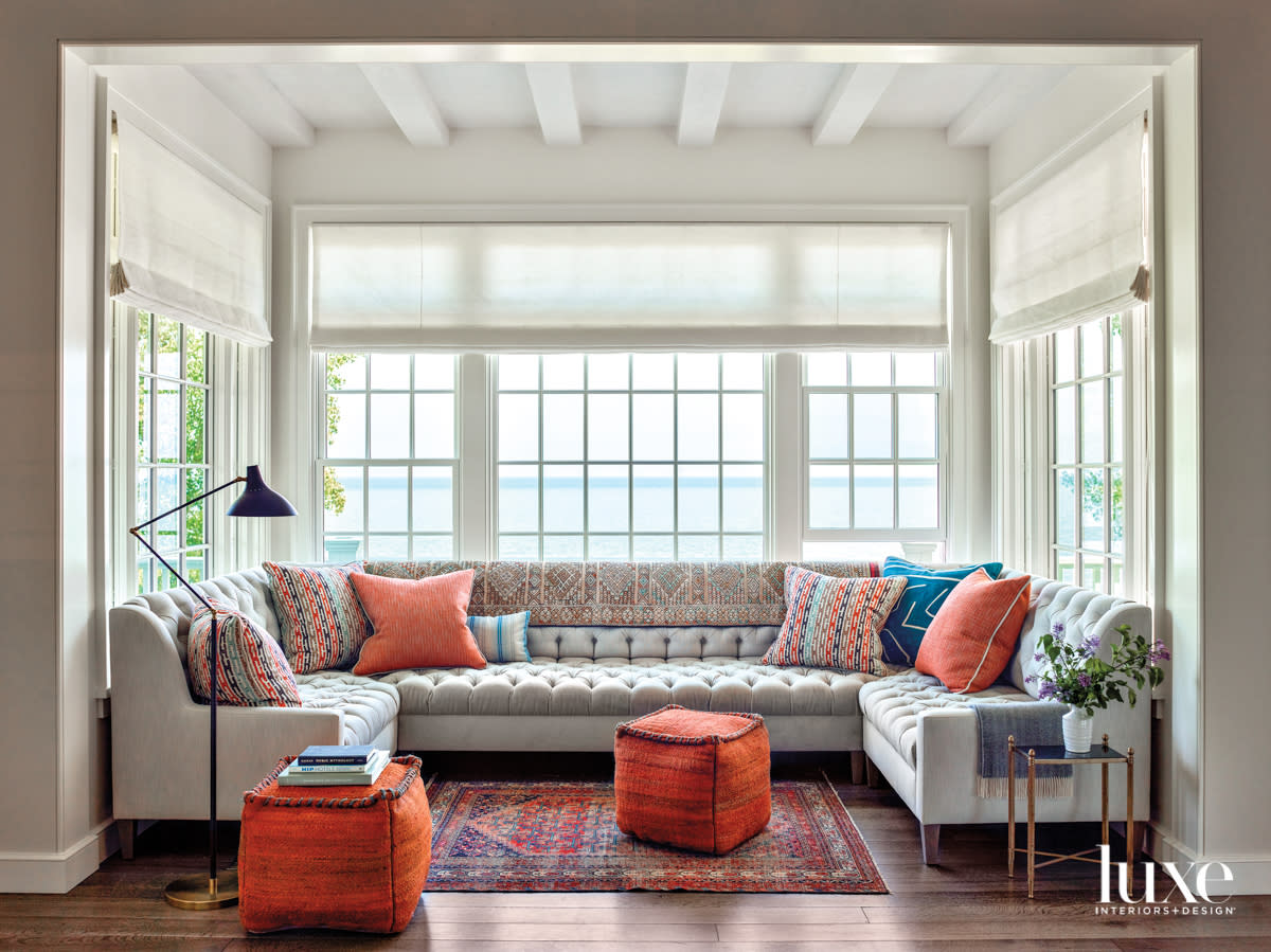 A sectional in a window area that overlooks Lake Michigan.