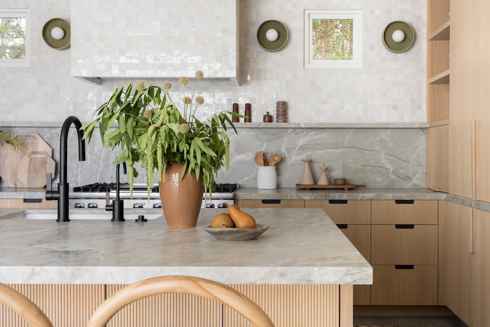 contemporary neutral kitchen with light wood cabinets and furniture