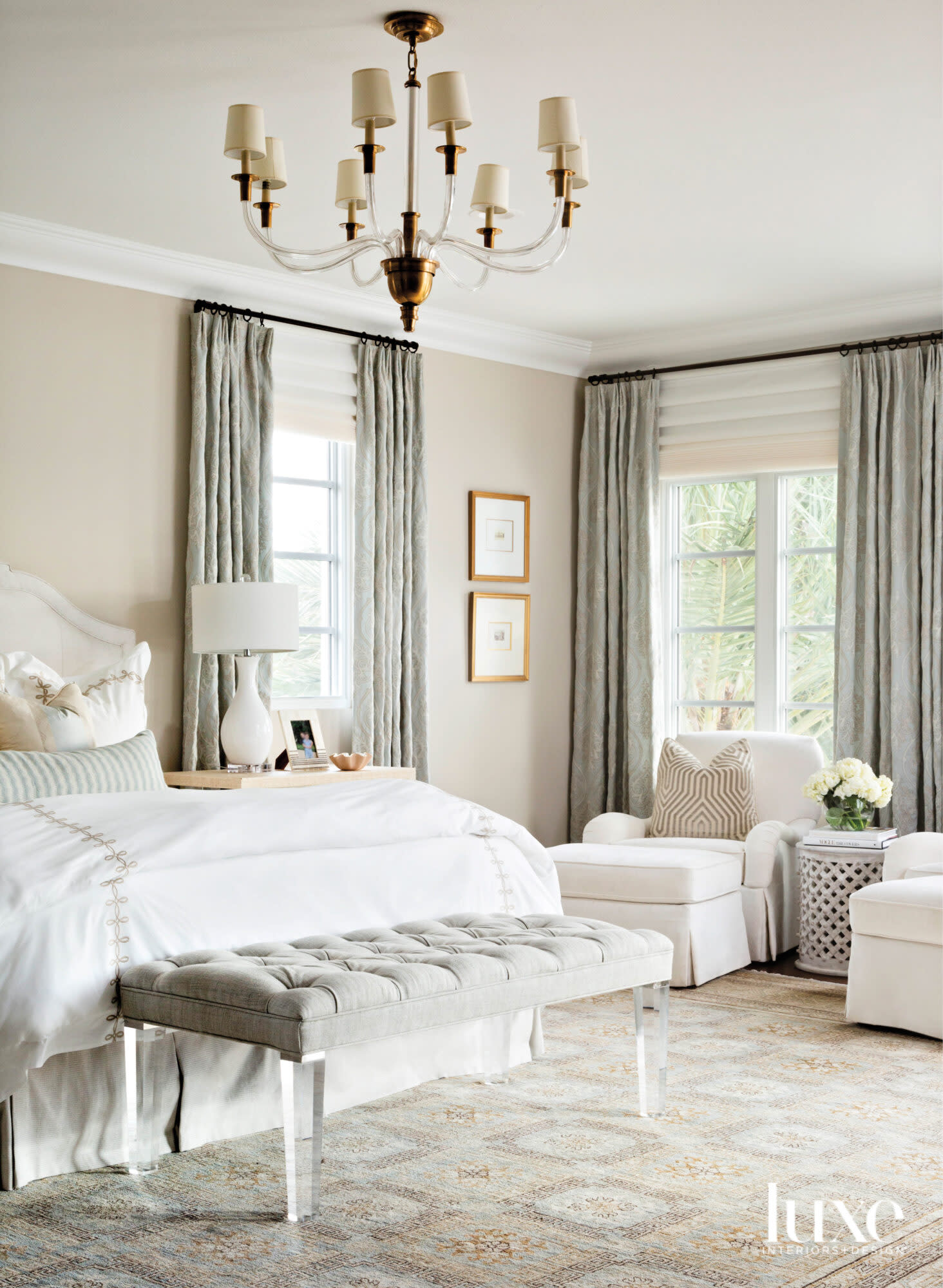 Main bedroom with lucite bench and armchairs.