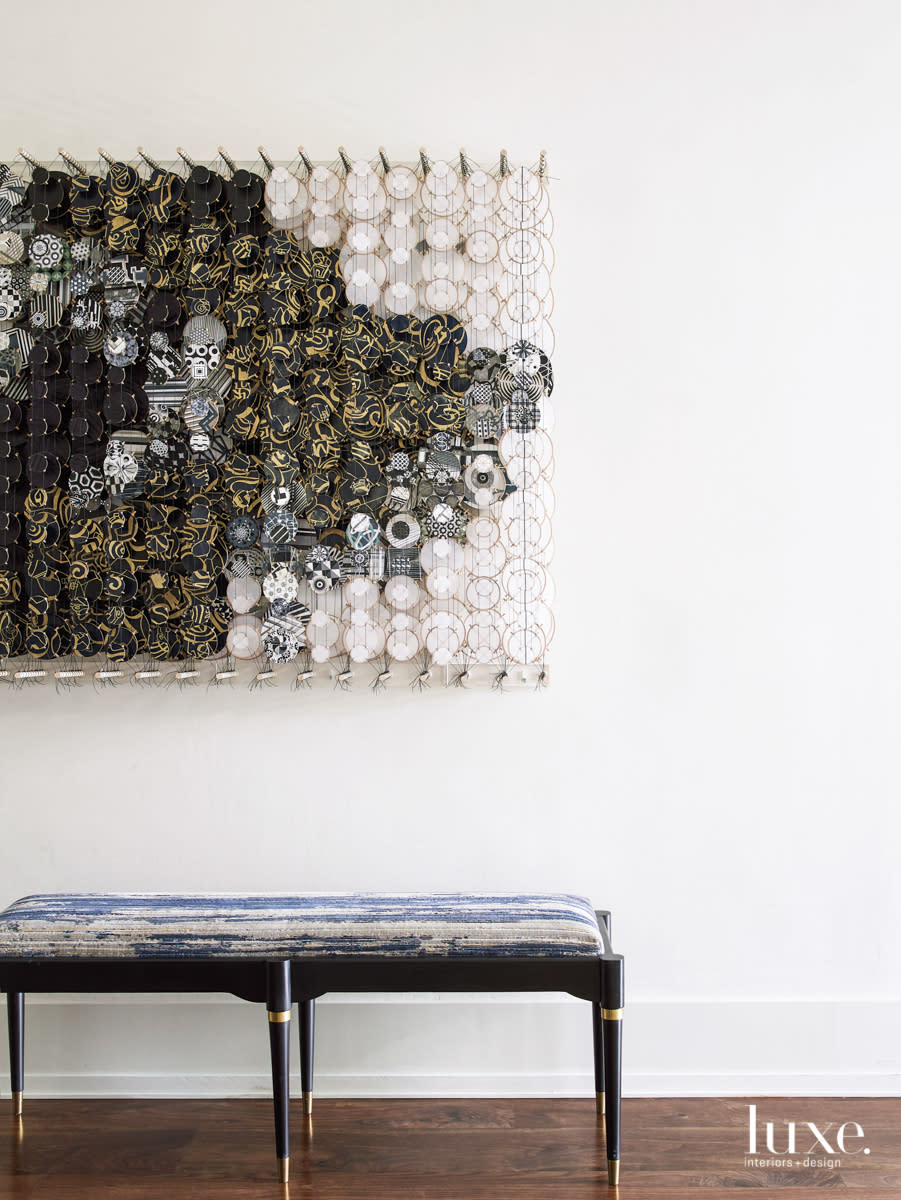 entry hall with jacob hasimoto art and a bench