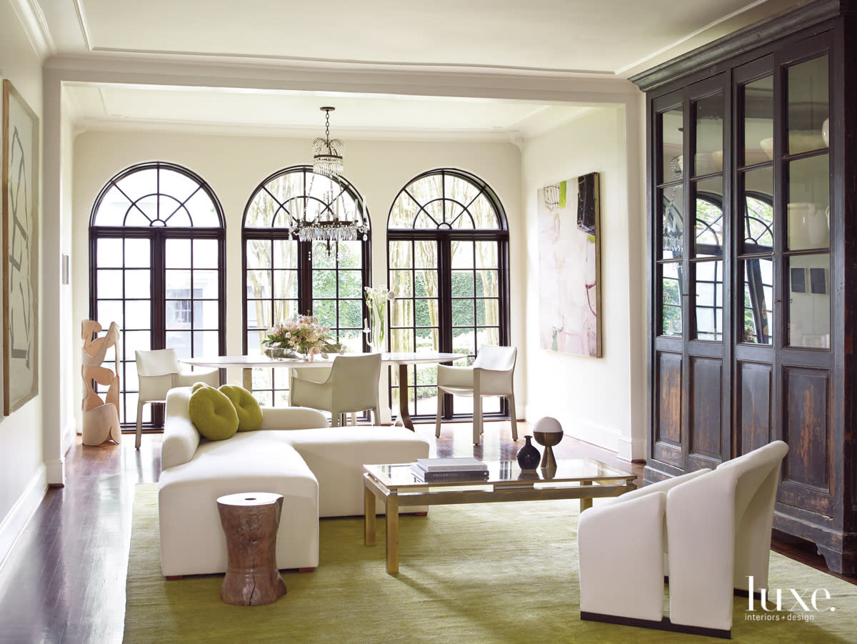 Light-filled dining room seating area with vintage and contemporary furnishings