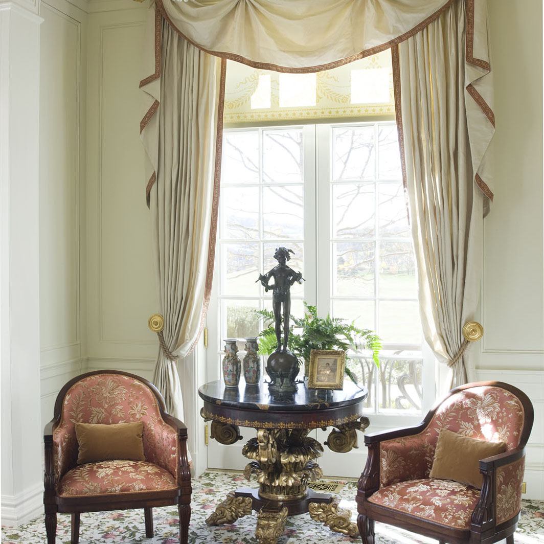 Curtains in the drawing room at Drumlin Hall were inspired by a French design by Ernest Foussier, 1900. The trim was simplified by using a silk tape woven to match the damask upholstery of the chairs.