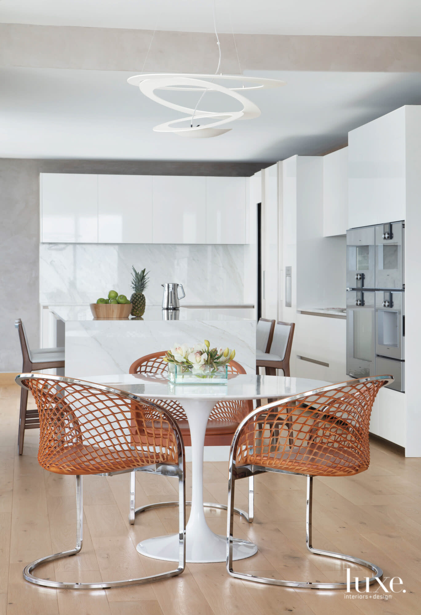 kitchen and breakfast nook with high-gloss cabinetry