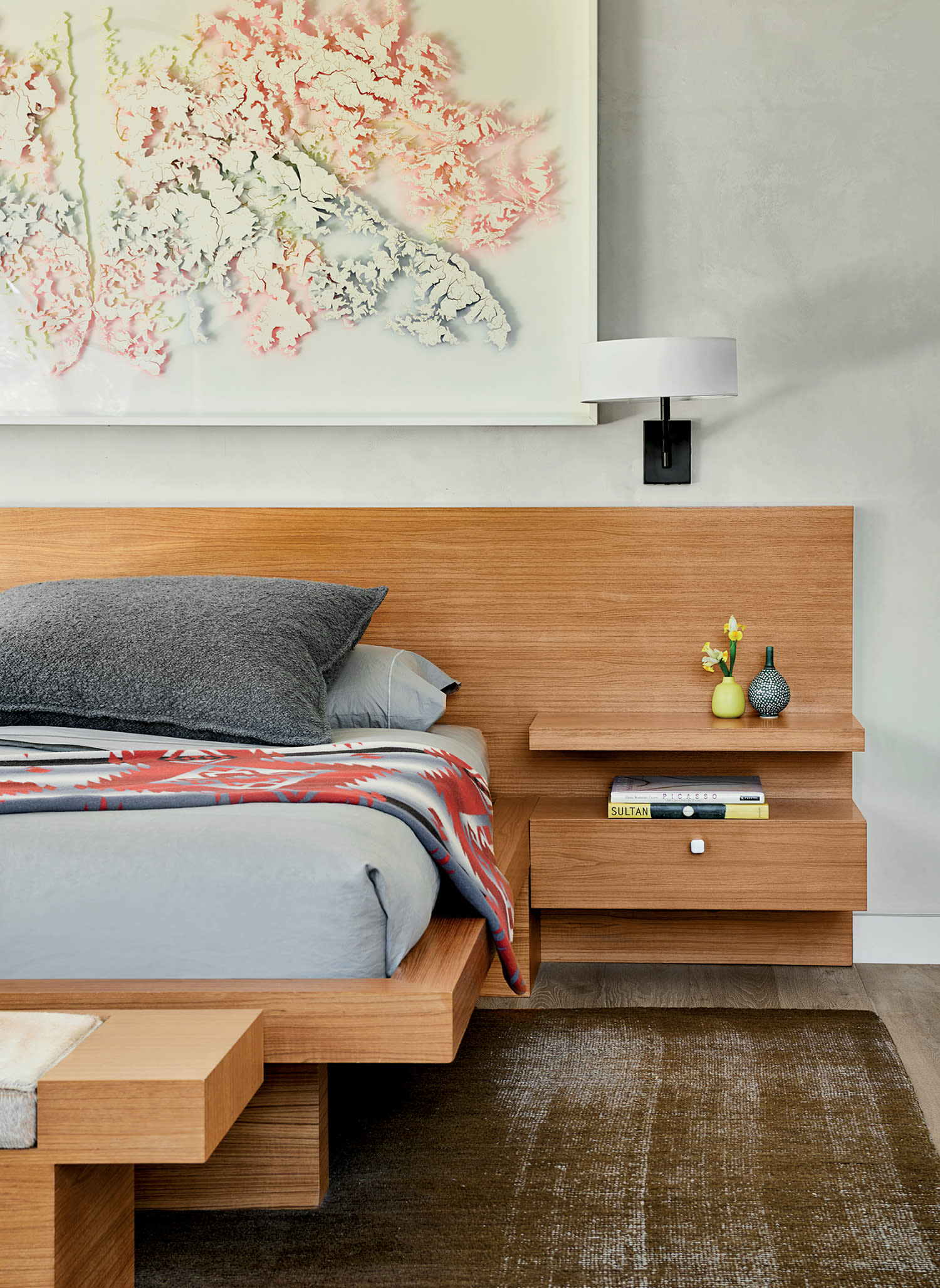 cozy bedroom with a teak-framed bed and matching nightstands 