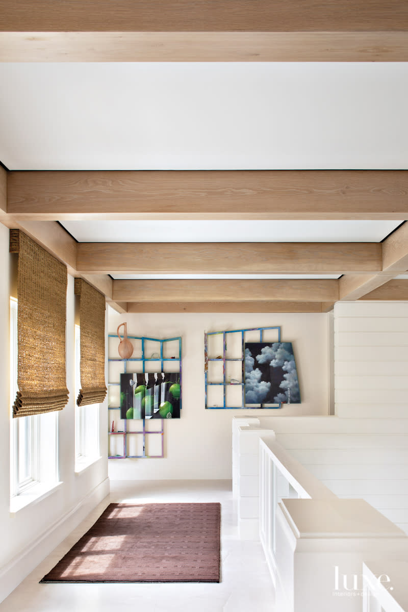 lofty living area with woven shades in home by Peter Moor