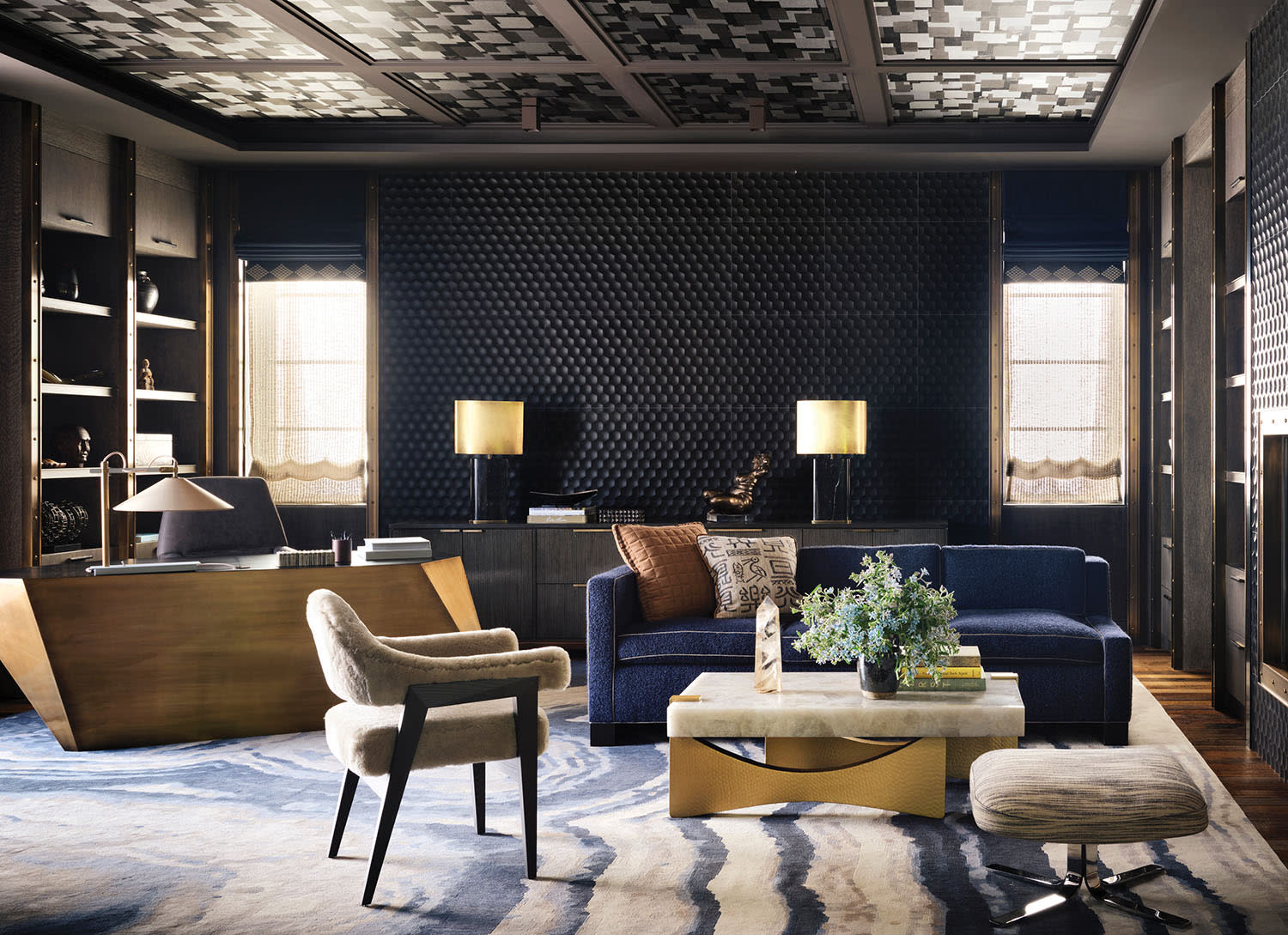 moody study with black limestone walls trimmed with brass accents