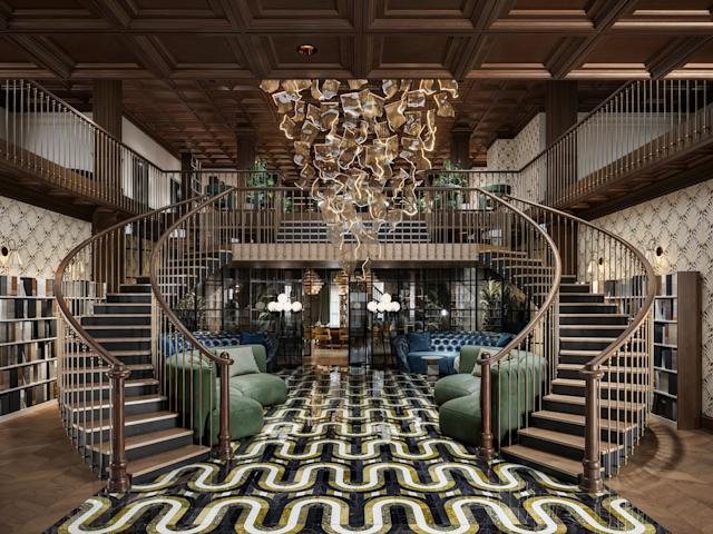 Luxurious library with dual spiral staircases, intricate black and yellow floor pattern, central abstract chandelier, and plush green seating.