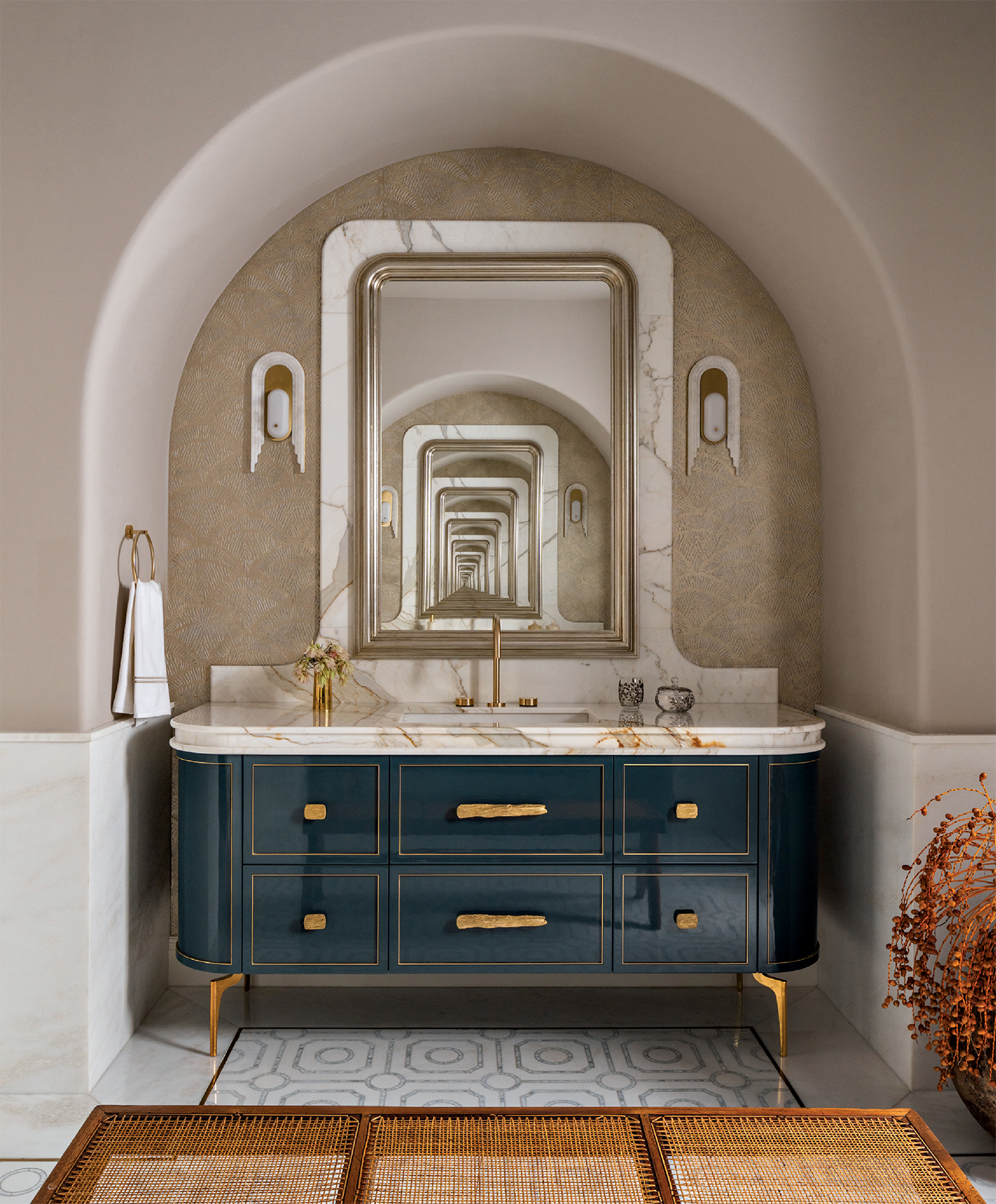 modern bathroom with a blue vanity set within an arched niche