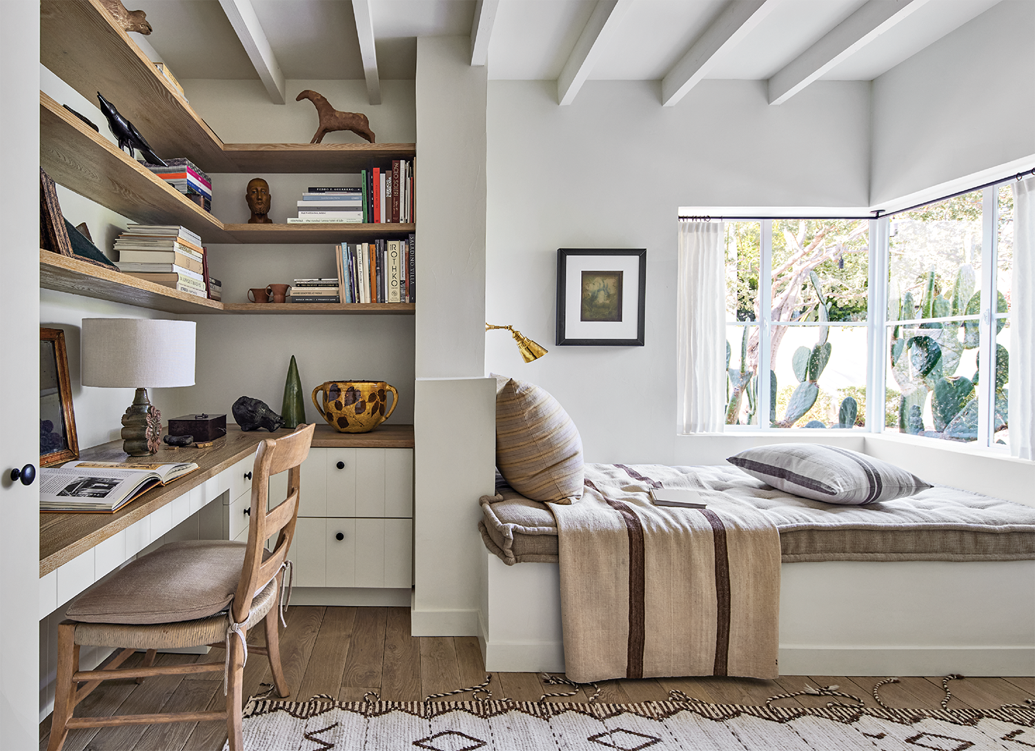 cozy den/guest room with a daybed and an office space