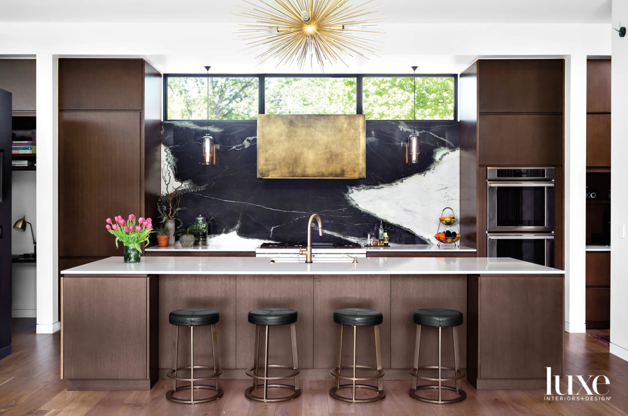 Rift-sawn oak cabinets and dramatic black-and-white stone backsplash