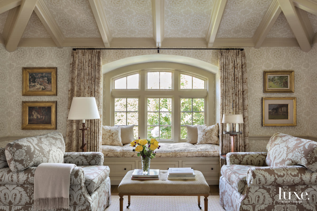 Printed, neutral-toned designs cover the master bedroom