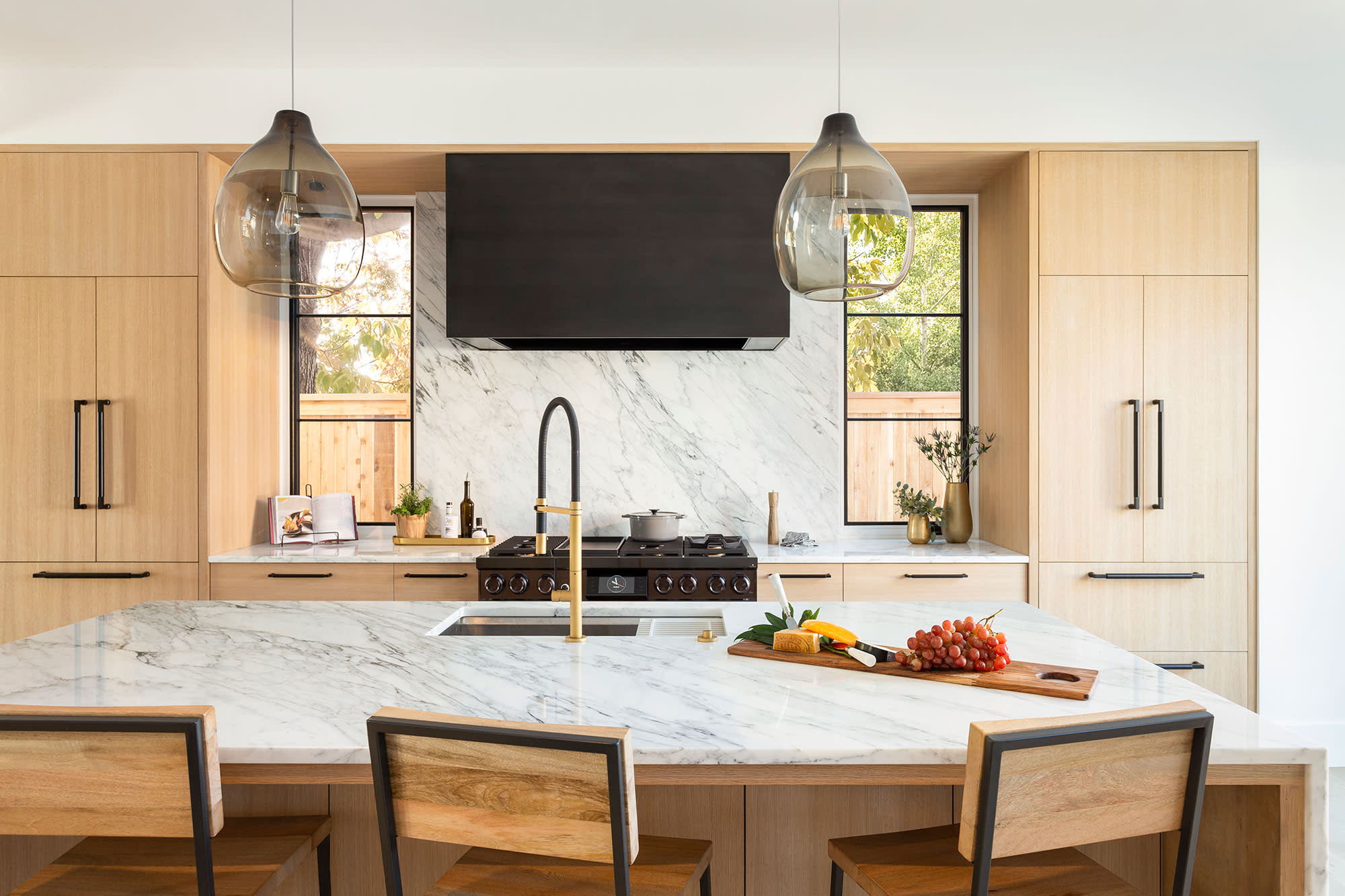 white and wood kitchen with dacor appliances