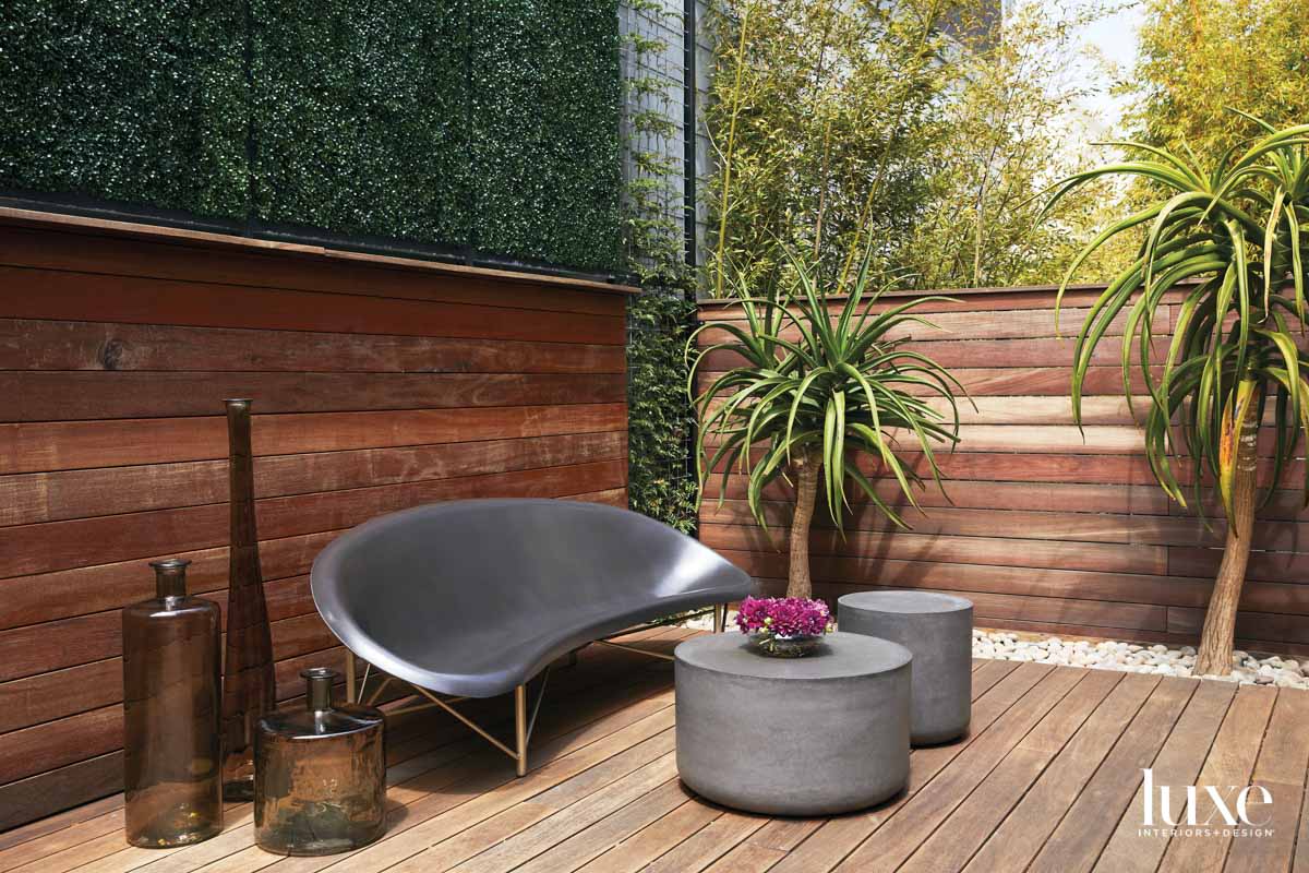 A deck features an oval bench that's heated.