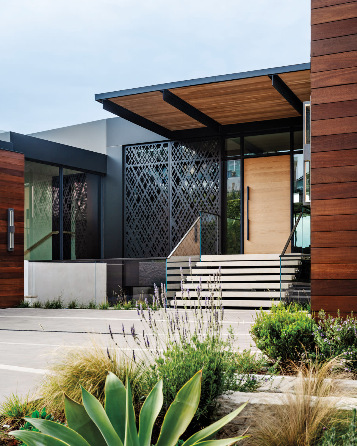 entryway of a home with diamond-patterned exterior metal panels 
