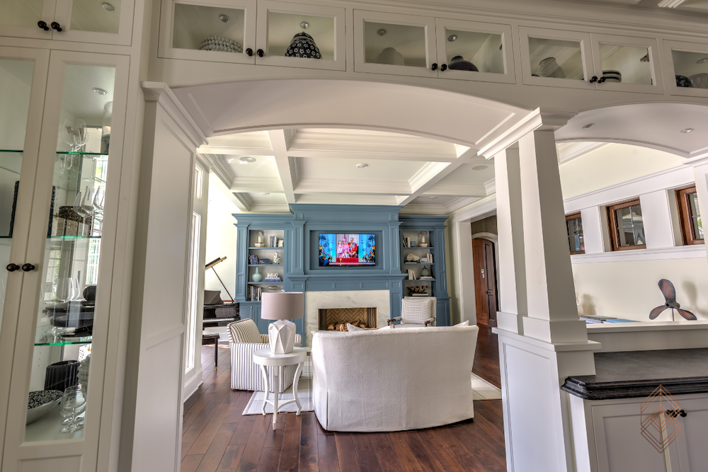 A cozy living room featuring a television and a warm fireplace, creating a welcoming atmosphere for relaxation.