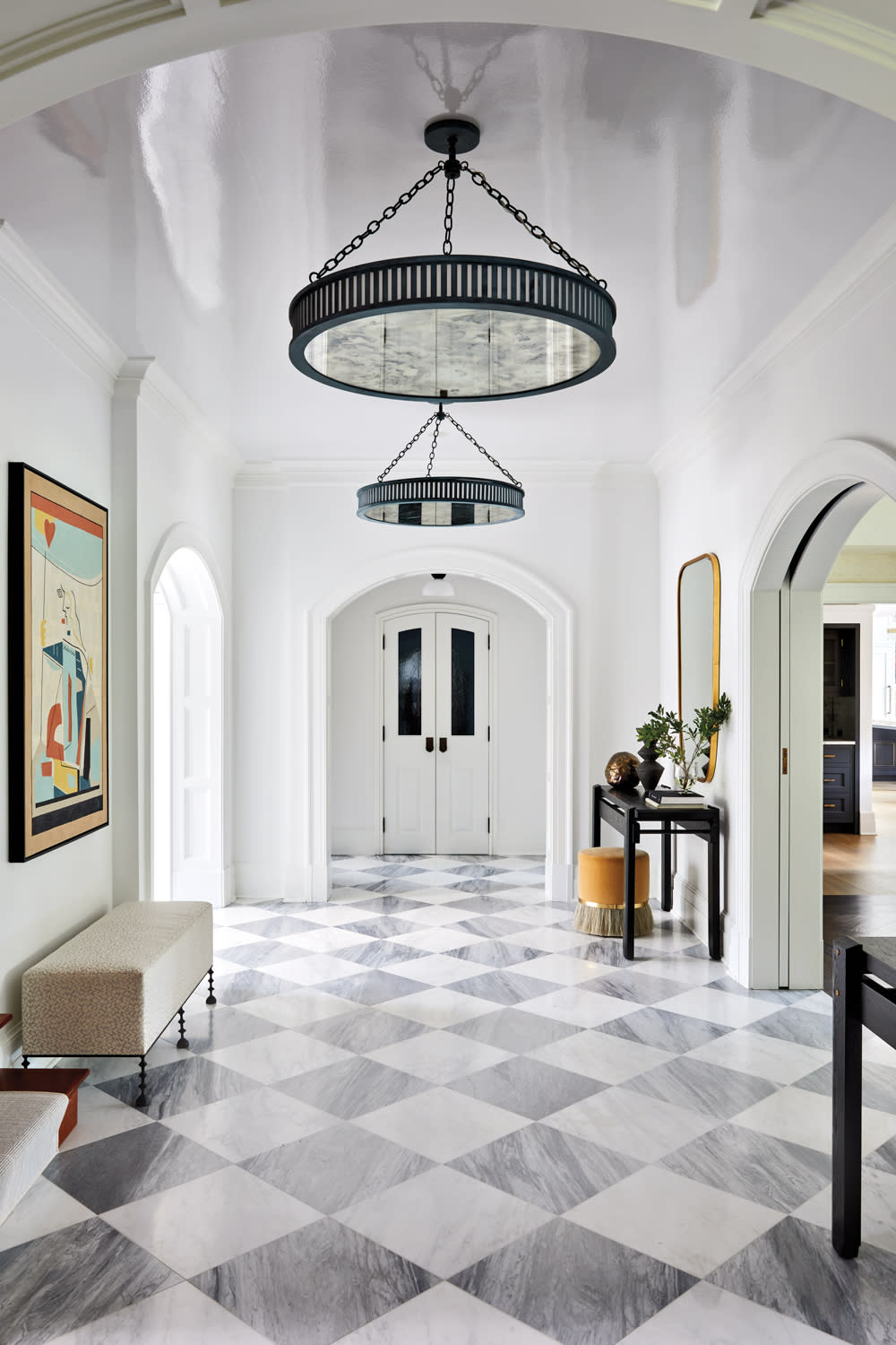 entry hall with marble floor tiles and lacquered ceiling in home by Rachel Sherman