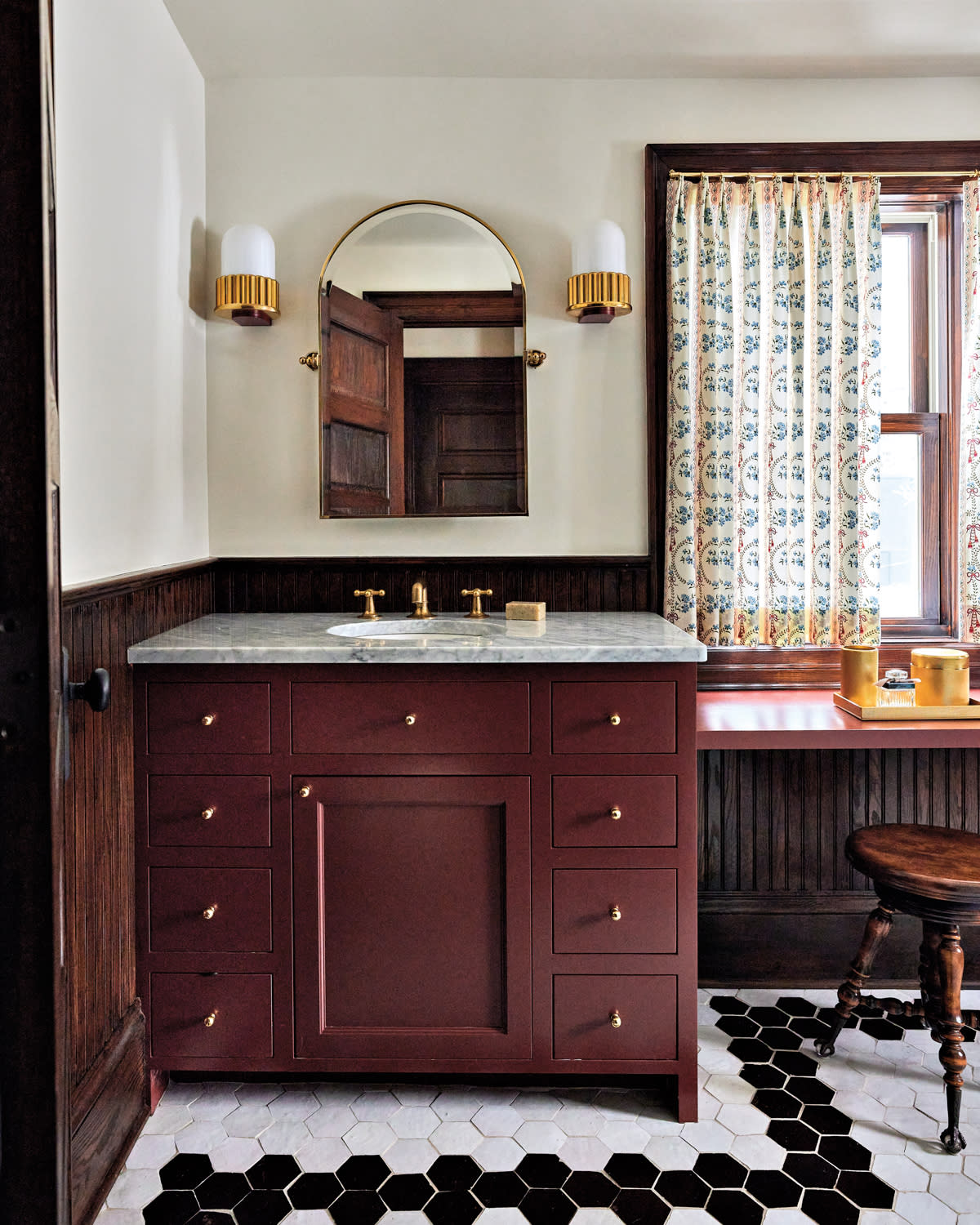 Bathroom with mahogany furnishings and checkered tiles by Anne McDonald