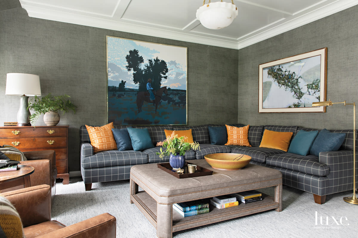 living room with gray wallpaper and antiques