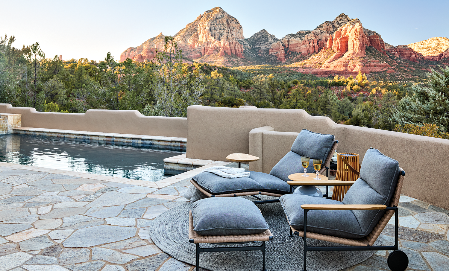 Arizona home's rear patio featuring a saltwater pool and silver flagstone patio