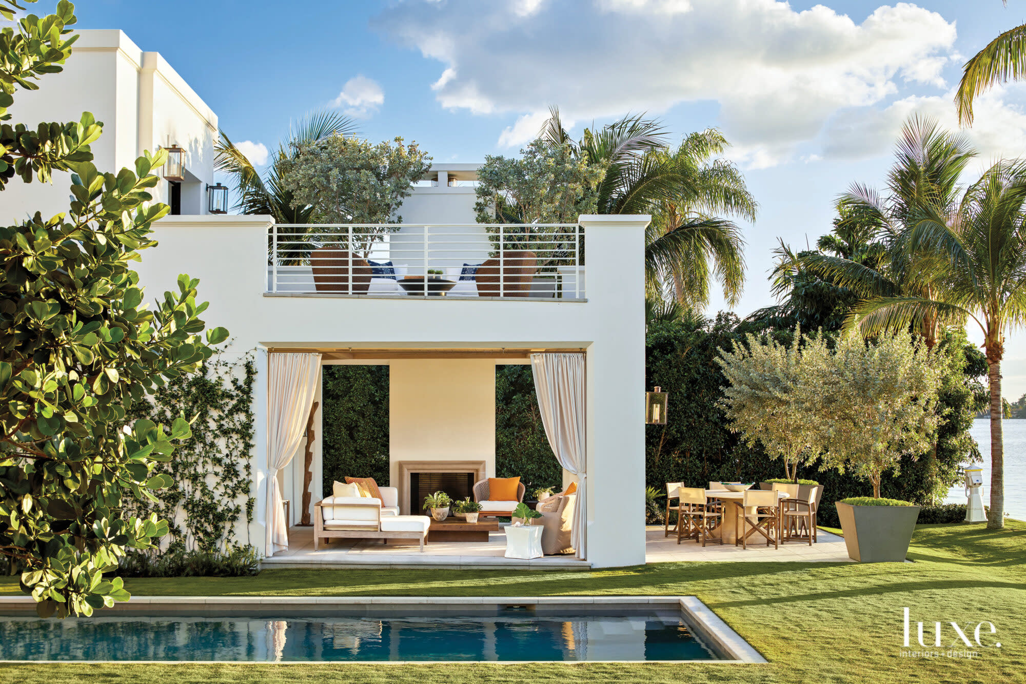 back exterior with pool, loggia and balcony