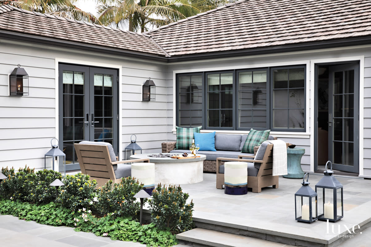 outdoor patio deck with fire pit and lanterns