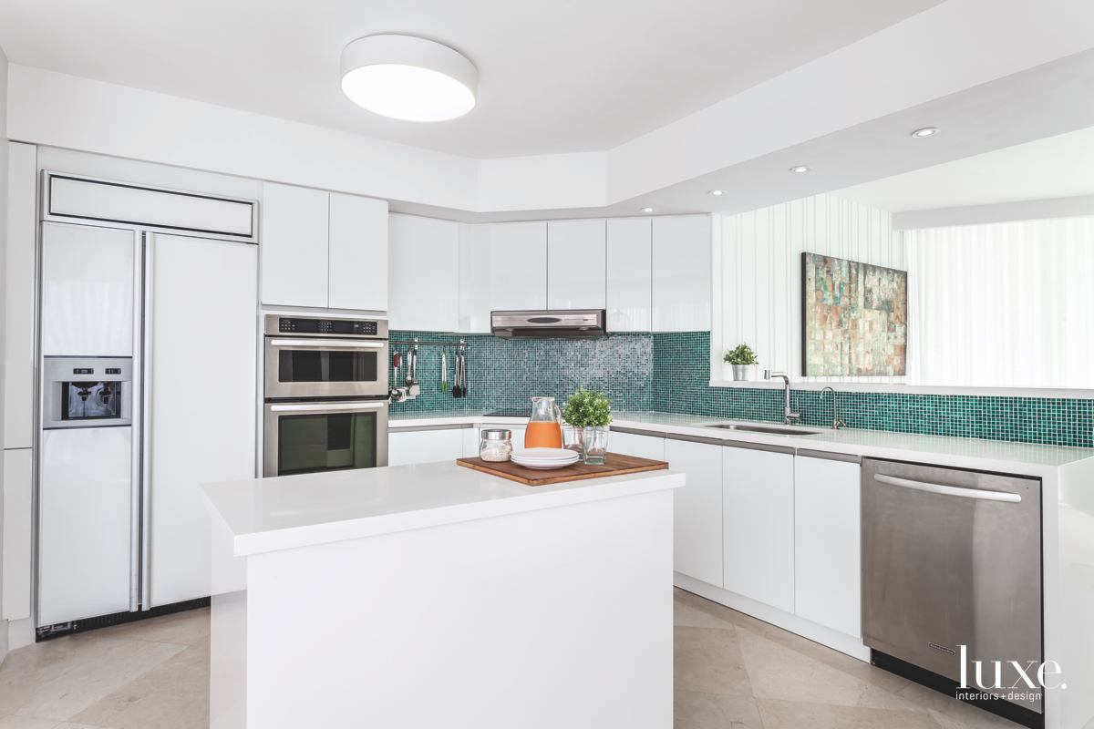 modern white kitchen green mosaic backsplash