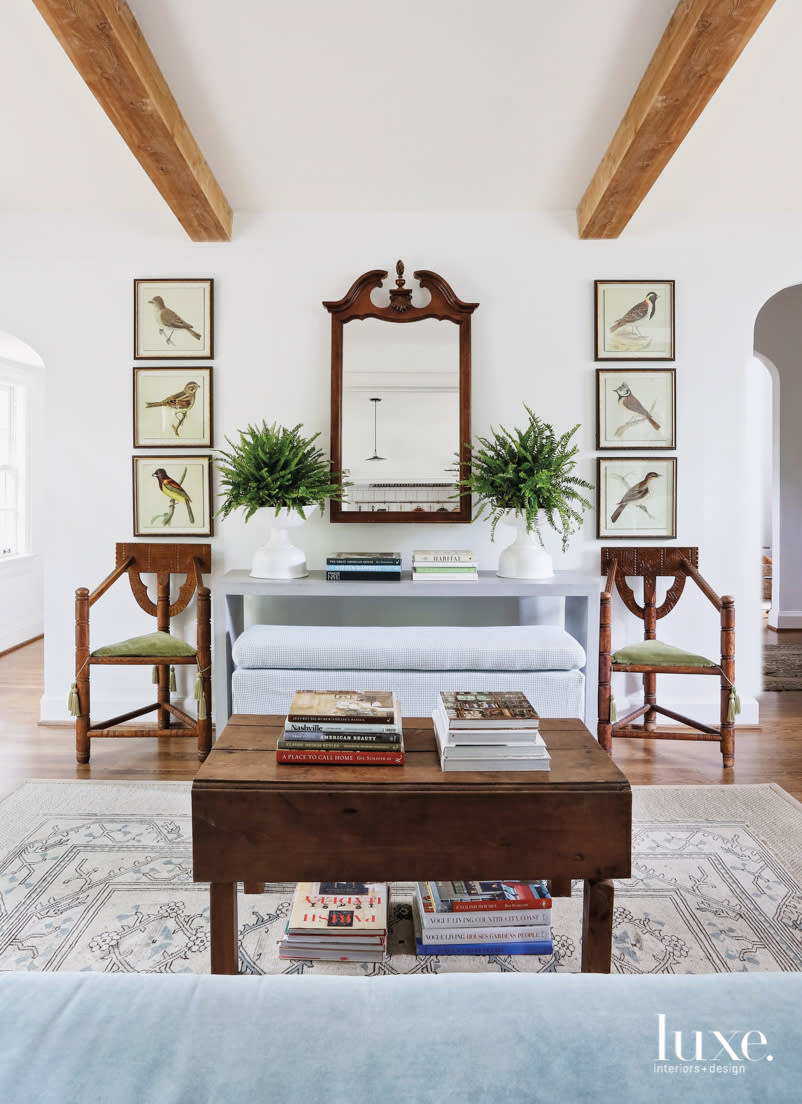 family room with swedish monk chairs waterfall concrete console