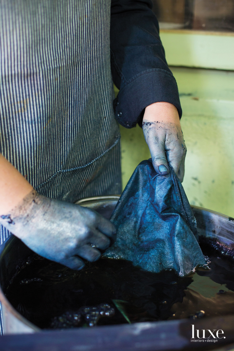 Her hues are applied to linen cloth that's dipped into vats of natural dyes.