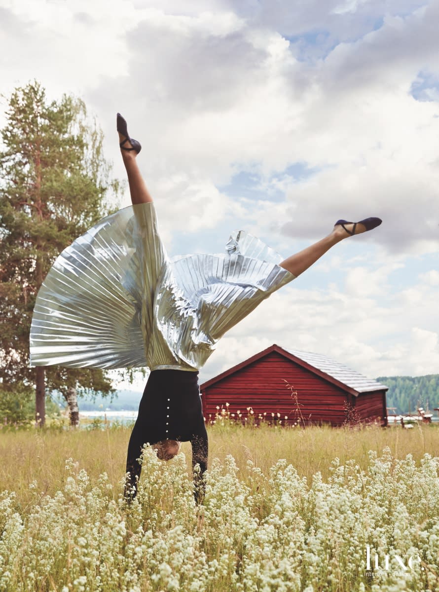 THE HILLS ARE ALIVEIn Edefors, an idyllic field of wildflowers makes an exquisite picnic spot close to the river. Citizens of Humanity thermal top. DKNY pleated skirt. Capezio leather ballet slippers.