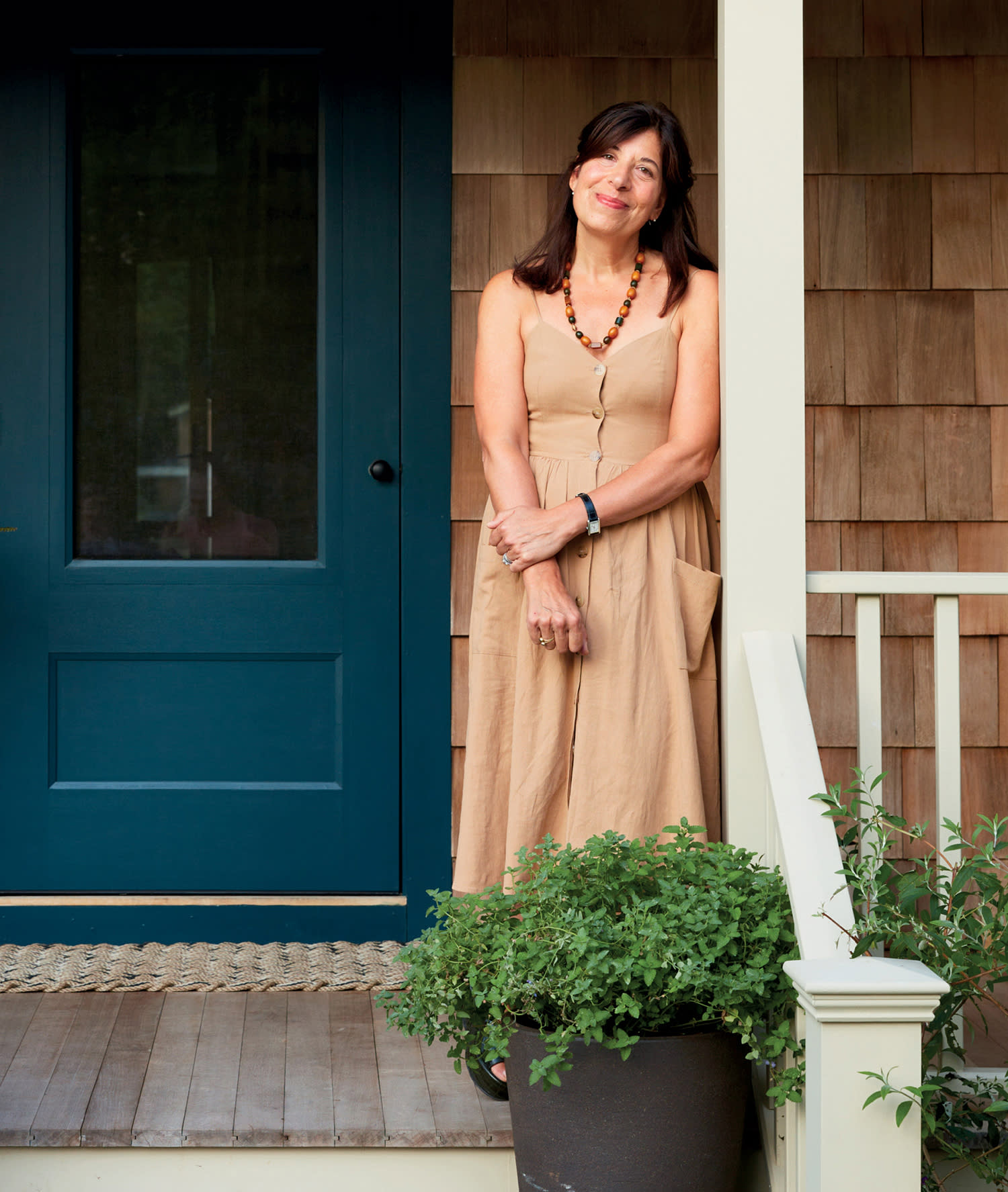 Designer Joan Enger on the porch of her Amagansett home
